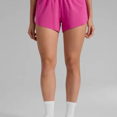 CRZ YOGA Mid Waisted Dolphin Athletic Shorts for Women 4" Lightweight High Split Gym Workout Shorts with Liner Quick Dry