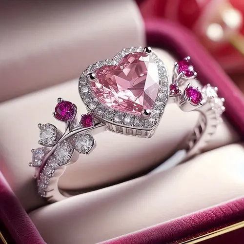 A luxurious heart-shaped wedding ring for women, set with pink cubic zirconia – a dazzling bridal jewelry piece, a promise ring featuring the birthstone for April, suitable for Valentine's Day gifts or everyday wear.