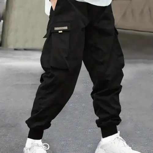 Men’s spring/autumn cargo jogger pants with side large pockets, cuffed ankles, a loose fit, and a tapered hem—ideal for streetwear styling, campus everyday wear, and functional looks.