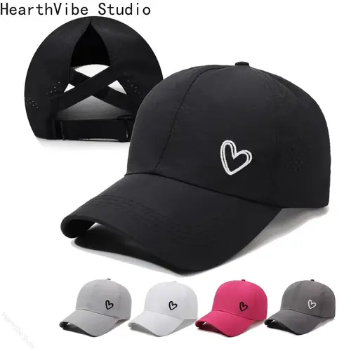 A Solid-color Heart-shaped Baseball Cap with an Adjustable Snapback Strap, Designed to Be Worn with a High Ponytail Tied Across the Back. Features a Breathable Mesh Panel at the Back. Available in White/black/gray/rose Red. Suitable for Golf, Cotton,summe