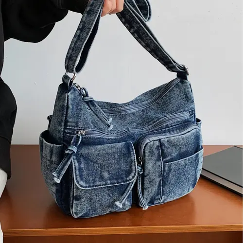 Light blue denim multi-pocket large capacity crossbody bag, vintage distressed workwear style shoulder bag, casual commuting tote bag, Denim Shoulder Satchel, suitable for commuting, shopping, work, campus, casual outings, and everyday accessories