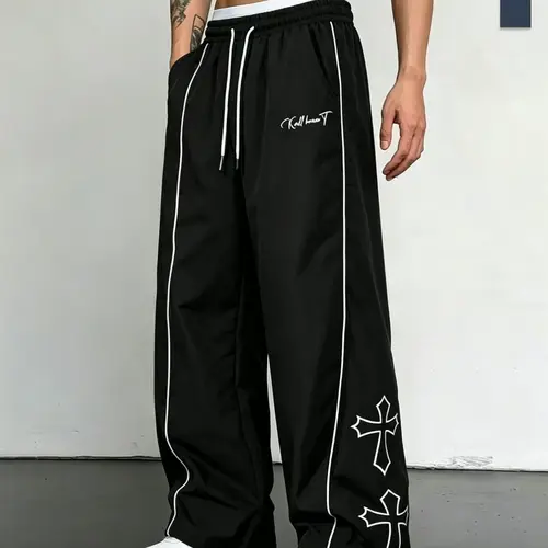 Men’s casual straight leg pants featuring side stripe letter print and an elastic waistband; suitable for sports and leisure, street fashion style, ideal for dancing and everyday commuting—an essential piece for summer travel outfits.