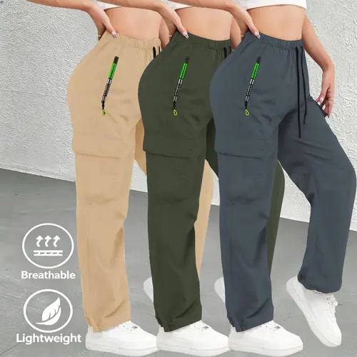 3-pack women’s athletic casual cargo pants with zippered pockets; these pants feature stylish large pockets and an elastic waistband with adjustable drawstring; slim-fit long pants suitable for casual wear.