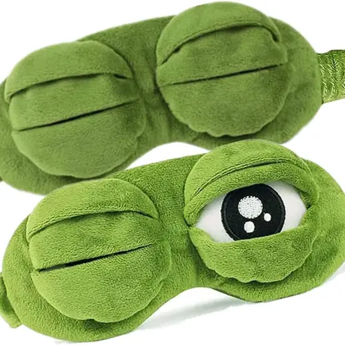 Frog Sleep Mask — A stylish, shimmering sleep mask featuring an adorable "Sad Frog" design. This fun, plush eye mask is perfect for travel, yoga, napping, and light-blocking; its soft cotton lining gently cares for sensitive skin.