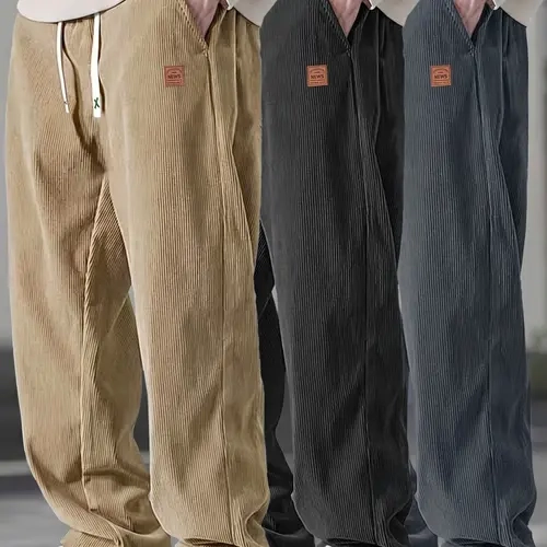Men’s relaxed-fit black corduroy casual pants — lightweight for summer with a drapey feel, leather tag detail, drawstring elastic waistband; suitable for work and everyday wear.
