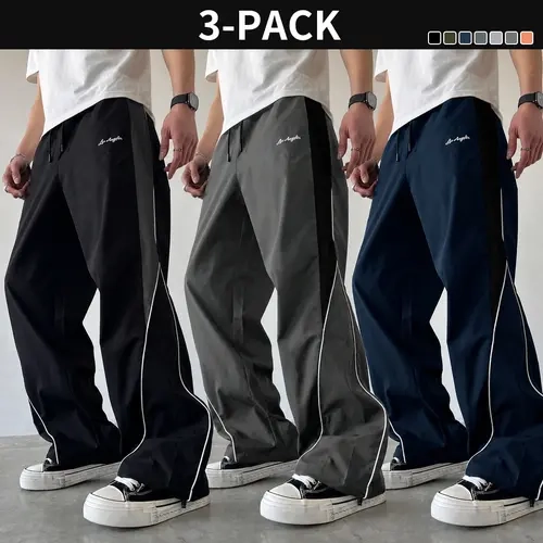 3-pack men’s casual wide-leg athletic sweatpants with side contrast stripes, embroidered lettering, and drawstring cuffs, loose fit
