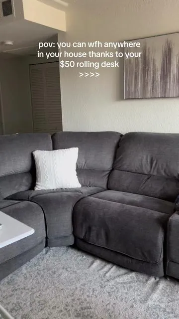 Can you tell how happy I am I got one?😂 Catching up on the Epstein case & admin work at the same time💁🏽‍♀️  You can literally work from anywhere in your home, standing or sitting because it’s adjustable too!🙌🏽 get it from the Tiktok Shop! #sweetfurniture #sweetcrisyfurniture #tiktokshop #adjustabletable #portabletable #wfhmusthaves #stanleycup #stanely #epsteinisland 