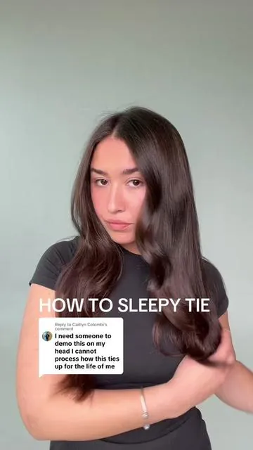 Replying to @Caitlyn Colombi how to sleepy tie: Start with a blowout, brush your hair, ho into a high pony, loop the pony through the arch, wrap the hair around, grab BOTH sides of the scrunchie and secure the bun #wakeupwithperfecthair #sleepytie #sleepytiehair #hairtutorial #haircare #haircareroutine #hairhack #heatlesshair #easyhaircare 