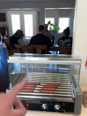 This hot dogg roller was awesome for this football party… #hotdogs #hotdoglovers #grilledhotdogs #hotdogrecipe #hotdogroller #traegergrills #grillingseason #burgersanddogs #grilling #grillmaster 