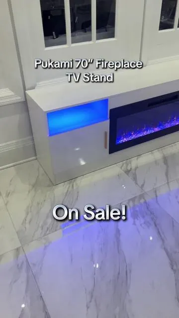 I love this Pukami Fireplace TV Stand! It’s 70 inches long and can fit 80 inch TVS or smaller on top of the unit! It does 16 Different LED colors and 12 Different Flame Colors. It has a touchscreen glass fireplace to control it by, and you can use the remote! It has 750 Watts to 1500 watts of Heat and 1-8 hour Timer settings. Click on the cart to check it out. #fireplace #tvstand #tv #heat #homedecor #decor #furniture #design #style #fyp #tiktokshop #sale #deals #musthaves