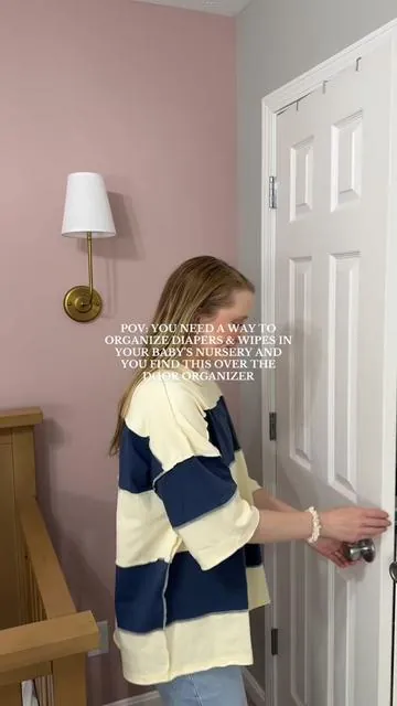 This is the BEST nursery organization hack especially if you have a smaller home!! 🧺🧸🛌 #nurseryorganization #nurseryinspo #babyorganization #nurserycloset #babyclosethack #organizationtips #overdoororganizer #organizationideas 