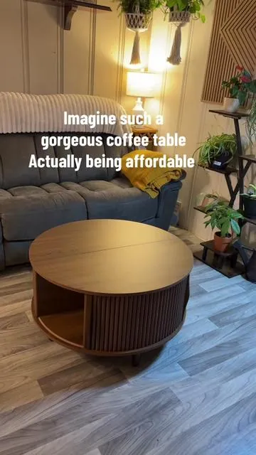 This round Boho-style coffee table is the ultimate blend of beauty and function! It features hidden storage, a sliding top, and plenty of space to stash blankets, books, or anything you want out of sight. Stylish, space-saving, and perfect for cozy, curated living rooms #TikTokMadeMeBuyIt #BohoVibes #BohoHomeDecor #SmallSpaceLiving #HomeInspo #CoffeeTableGoals #FurnitureHack #HiddenStorage #TikTokShopFinds #AestheticLiving #NeutralHomeDecor #BohoStyle