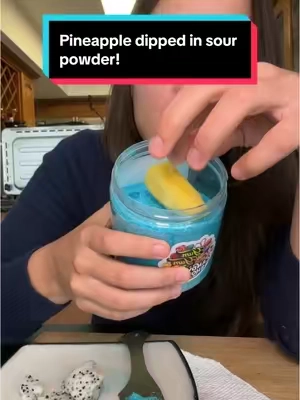 This is gonna be my summer snack  #pineapple #candydipping #candypowder #dippingfruitsinpowder #sourpowder #lollipop #sourblueraspberry #sourblueraspberrypowder 