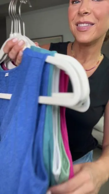 I wish you could feel how soft these tank tops are through your phone. My favorite throw on and go top for summer. #tanktop #flowytop #vneck #summerstyle #summertops 