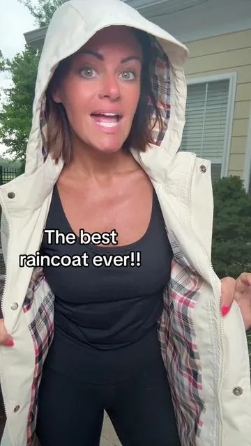 Hooded trench raincoat with a hood that covers your hair! Plaid lining, drawstring around waist. Hands down my favorite raincoat on the market! Wearing a small (5'3 size 4/6). True to size or size up if you like jackets oversized but the arm are not tight. #dealsforyoudays #tiktokcreatorpicks #raincoat #trenchcoat #rainydays 