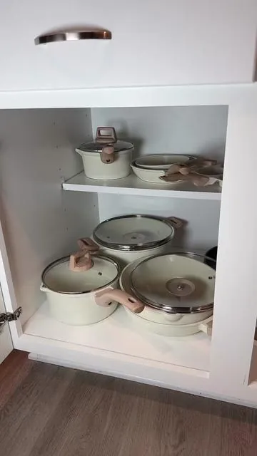 This expandable cookware organizer completely transformed my cabinet. No more digging for lids or stacking pans like Tetris—everything is accessible and easy to grab. Such a game changer for kitchen organization!
