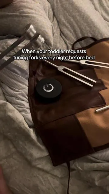 He just asked to learn to do them on his own 🥹 this set lives on our bed shelf bc he cannot sleep without them 💙 @enso sensory #tuningfork #frequency #frequencyhealing #soundtherapy #frequencies  