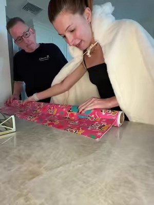 this wrapping paper cutting tool just made wrapping gifts for christmas so easy! #wrappinggifts #wrappinghacks #wrappingpresents #wrappingpaperhack #papercutter 