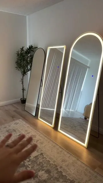 If you’re not sure which mirror to get, make sure to save this video!  Here’s a peek at a few options: 26x71 LED, 21x64 LED, and 20x63 arched without lights — all shatterproof nano glass. Comes with a kickstand and hooks for wall mounting, perfect for your vanity, bedroom, or beauty room. 🤍 #ledmirror #lightupmirror #homedecor #vanitymirror #fulllengthmirror 