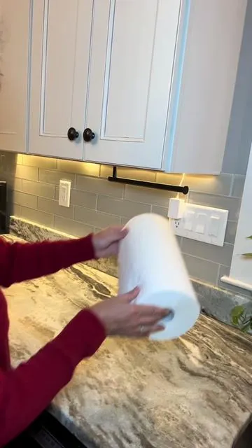 Give your kitchen an instant upgrade with this paper towel holder that can mount right under your cabinets or on the wall to free up valuable countertop space. #kitchenorganizer #declutter  #kitchentools  #papertowelholder