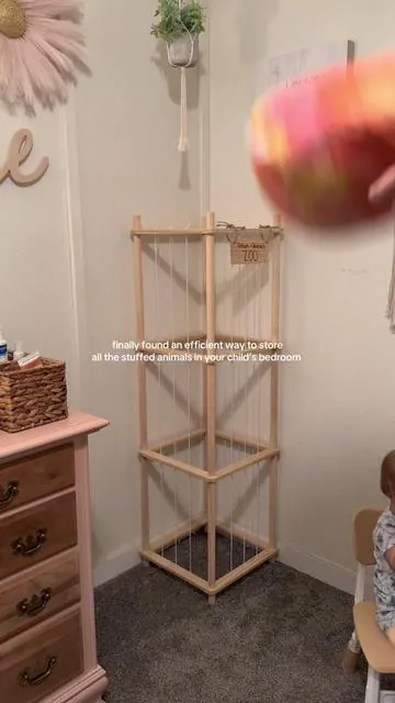 And they can help clean them up this way too!! So nice they have a place and aren’t scattered all over the house now 🤩 #toystorage #stuffedanimal #toddlermoms #toddlerroom #organizationhacks 