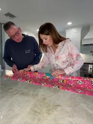 wrapping gifts hack! this wrapping paper cutting tool just made wrapping gifts for christmas so easy! #wrappinggifts #wrappinghacks #wrappingpresents #wrappingpaperhack #papercutter 