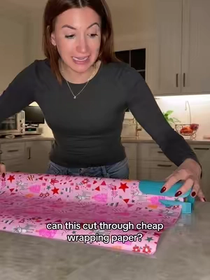 wrapping gifts hack! this wrapping paper cutting tool just made wrapping gifts for christmas so easy! #wrappinggifts #wrappinghacks #wrappingpresents #wrappingpaperhack #papercutter 