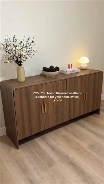Still can’t get over how beautiful this sideboard looks in my office soft curves, smooth slow-closing drawers, and a design that makes every detail feel intentional. Cozy and practical at once. And the wallnut color 10/10🤎🤎🤎 #sideboard #homedecor #buffetcabinet #homeoffice #livingroomdecor 