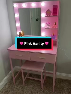 This vanity is gorgeous!! Such a perfect pink color! And it wipes clean so easily! #vanity #makeupvanity #vanitymakeup #vanitymirrorwithlights #christmasgiftsforkids 