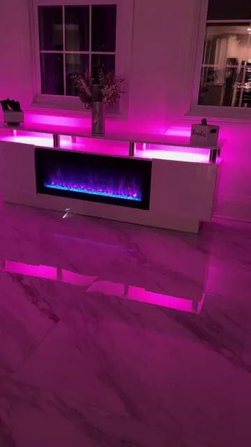 This 70” Fireplace TV Stand from Pukami is so pretty. It holds up to 80” TVs. It does 750w-1500w of Heat and has 1-8 hour timer settings. It has 20 Different LED colors and 12 Different Flame colors and you can change the colors on the jewels. Click on the link to check it out. @PUKAMI #fireplace #tvstand #fireplaces #furniture #tvstands 