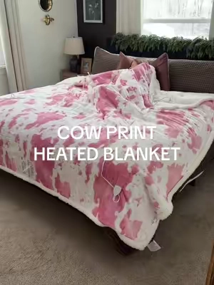 This blanket is a dream 😍✨  #bluniquehome #heatedblanket #cowprint #dualcontrolheatedblanket #holidayhaul 