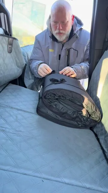 Dog Bed for the car this is perfect and when you get to where you are going you can take it out and use it as a dog bed.  #DogBed #Backseatdogbed #petproducts #dogowner 