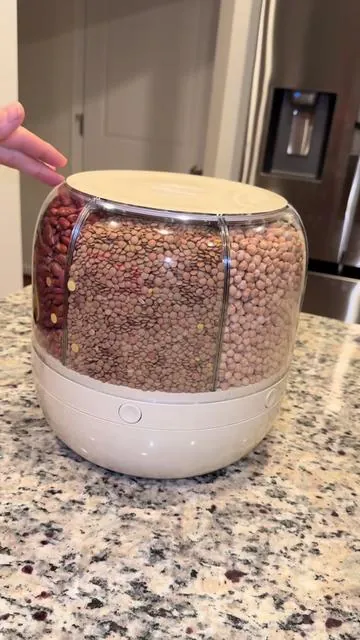 Smart storage, stress-free kitchen ✨ Keep your rice, beans, and grains fresh and organized with our 360° Rotating Grain Storage Dispenser. ✅ 6 grids for easy sorting ✅ One-click output, mess-free pouring ✅ Space-saving & stylish design Perfect for small grains, beans, and rice 🌾 Upgrade your kitchen storage today! #KitchenStorage #GrainDispenser #RiceDispenser #KitchenOrganization #HomeEssentials         