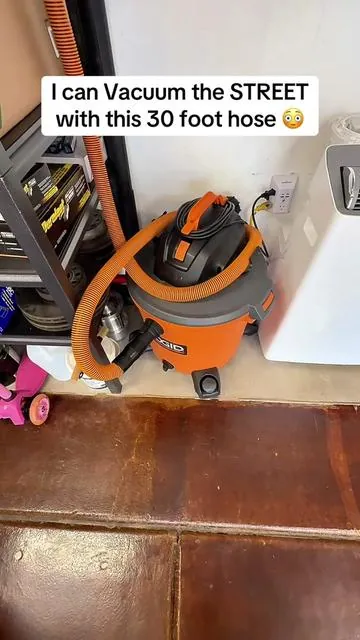 No more moving around that big shop vac! This 30 foot hose reel will cover my entire garage and then some.  #retractablehosereel #longvacuumhose #vacuumhosereel #garagehack #musthavetool 