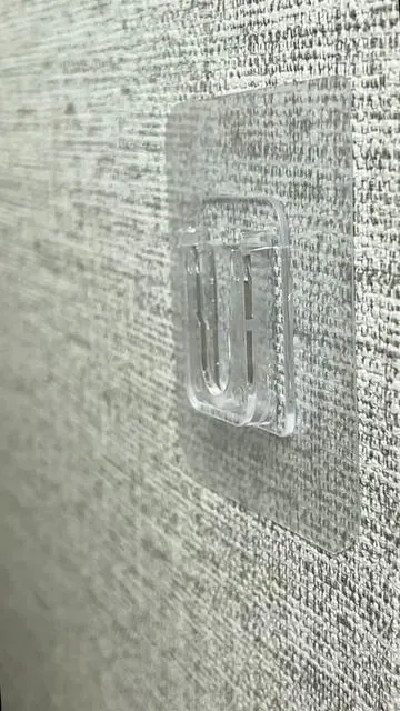 Hook and loop adhesive strips—no drilling required. Easy to install, they let you hang all kinds of small items on walls. Portable and a must-have for every household.#homegoods #diyhacks #home #wall #fyp