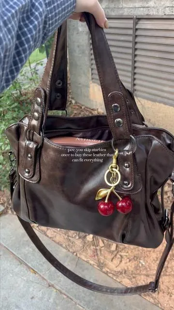 It holds all my things for school🤩#unibag #brownbag #schoolbag #bags #leatherbag 