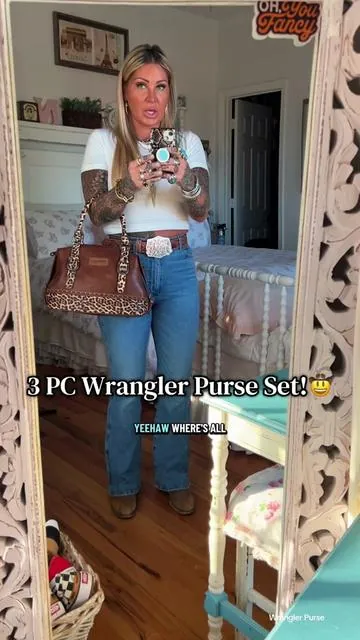 A Wrangler Purse that comes with a Wrangler Purse that comes with the cutest lil round leather coin purse! Somebody said it was for earbuds 🤷🏼‍♀️ I truly love the shape of this purse and what a bonus that she comes with minimes!🤩 #wranglerpurse #wranglerbag #wrangler #westernstyle #westernfashion 