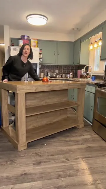 This warm kitchen island completely transformed my kitchen space by allowing me to have more kitchen counter prep space plus an extra table for my family to sit at and even do activities. My kids actually sit here and watch me cook now I’ve pretty much started redecorating my entire kitchen around this kitchen island. ##kitchenisland##midcenturymodernfurniture##kitchenupgrade##cookingprepspace##affordablefurniture