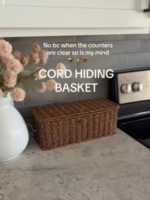 Cords drive me insane!! This basket easily hides them and adds bonus storage #chargingcord #cablemanagement #clutterfree #organizingideas #storagebasket 