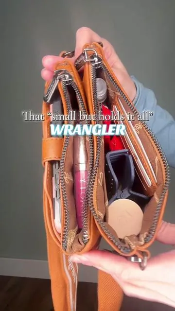 How does this little bag fit so much?! @Rustic Charm Bootic #wrangler #wranglerpurse #purseobsession #westernstyle #wranglerbag 