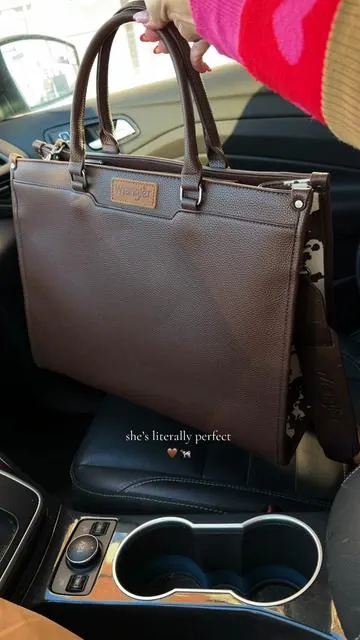 Obsessed #wrangler #cowprint #cowprinttote #laptoptote #bagtok 
