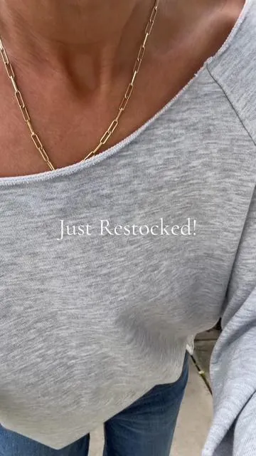 The wait is over ✨ This casual slouchy off-shoulder shirt is restocked—effortless fit, super comfy, and comes in several colors. #offshouldertop #workouttop #springoutfit #slouchytop #fisoew 