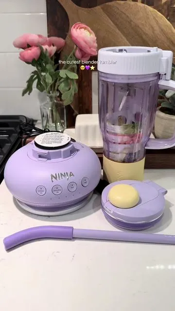 🥹 seriously how cute is this?! I bought the lavender lemonade color, and I’m so happy with how it looks! 💜⭐️ The Ninja BlendBOSS Tumbler Blender with 26oz Travel Tumbler & Removable Straw has a 1200-watt motor and one-touch Auto-IQ to sense what you’re blending and take out the guesswork. It comes with a chug lid plus a straw that fits inside the chug lid so that you can take it with you on the go without any spills! #ninja #ninjablender #blendertumbler #aesthetickitchen #blender 