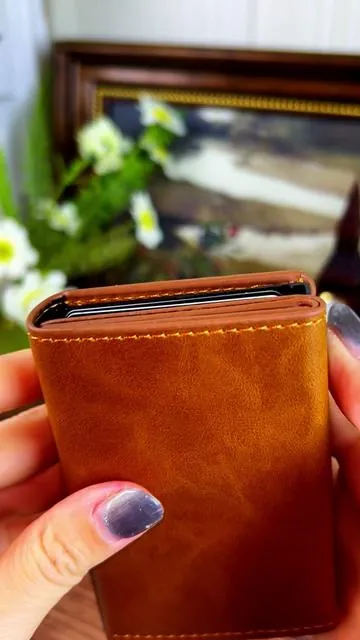 Pull the trigger and ALL your cards pop up effortlessly—super clean and super fast. It’s got a slot for your AirTag (or your guitar picks, if you’re a player like me). I’ve had a bunch of wallets but this carbon fiber one is hands-down my favorite. Sleek, secure, and it just hits different. Link’s down below if you want one—comes in a few colors too! #MensWallet #EDCgear #GuitarLife #AirTagReady #TikTokMadeMeBuyI
