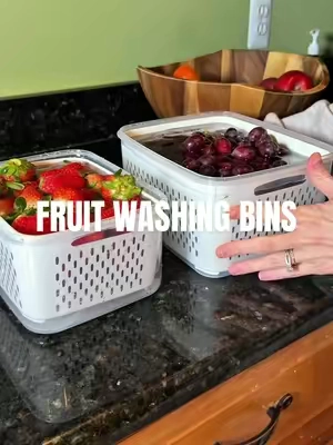 Stop cleaning your fruit with vinegar and baking soda - just choose one!  If you wondering how to stop your fruit from going bad so fast - this is how to make fruit last longer!  Clean strawberries, grapes, blueberries, etc in these fruit storage bins with strainer using vinegar and water! Let them sit and rinse for 10 minutes!  #fruit #kitchenessentials 