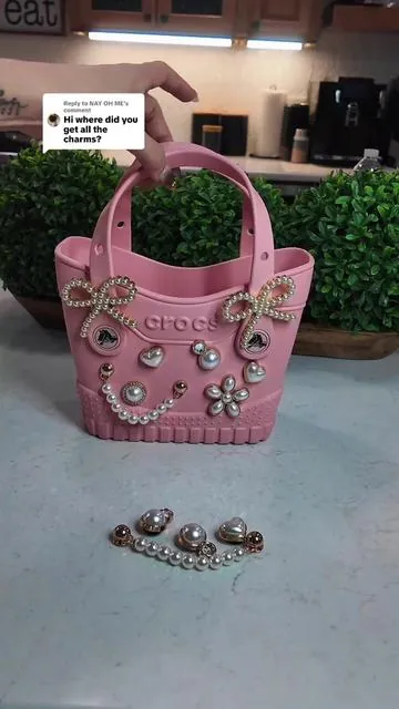 Replying to @NAY OH ME I love the Crocs Jibbitz Bag Charms ❤️ These Jibbitz are sooo good and high quality.  These charms are definitely secured in the Jibbitz holes so you won’t have to worry about them falling out.  The set I have is the Dainty Pearl Jibbitz.  I got them at @Crocs #crocs #jibbitzcharms #bagcharms #jibbitz #tiktokshopcreatorpicks 