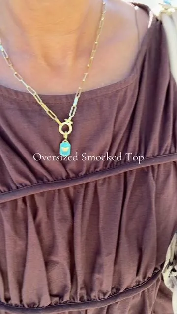 The smocked top you’ll reach for on repeat 🤍 Runs oversized (I’m in a size small) and comes in several gorgeous colors. Easy to dress up or keep it casual. #smockedtop #springoutfits #summeroutfits #vacationoutfit #smockedoutfit 