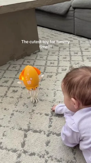 She loves it so much #tummytimy #dancingsquid #toys #baby #mom 