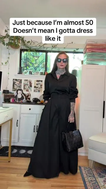 High-waisted dramatic wide leg pants for women who refuse to disappear after 40. Structured waist, heavy drape, and that almost-skirt movement when you walk. I’m 5’4” and love how powerful these feel styled goth or minimal. Gen X does not do basic. #GenXStyle #WomenOver40Fashion #AlternativeFashion #HighWaistedPants #tiktokshopfinds 
