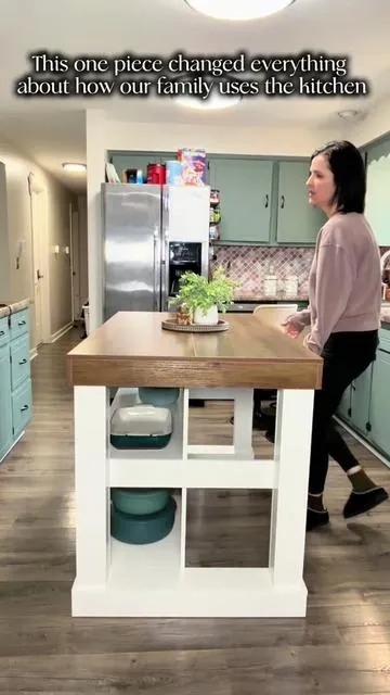 If you don’t have enough counter space in your kitchen, this island will make all the difference for you. It gives extra room for meal prep serving or even setting groceries down when you walk in. The shelves are perfect for putting dishes or decor on and it’s perfect for smaller kitchens that need more function without a full renovation. This kitchen island truly changed the entire way we use our kitchen. ##tiktokshopstockup##tiktokshopspringglowup##kitchenupgrade##kitchenisland##modernkitchen